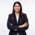 Portrait of happy young businesswoman arms crossed  with looking at camera on white background